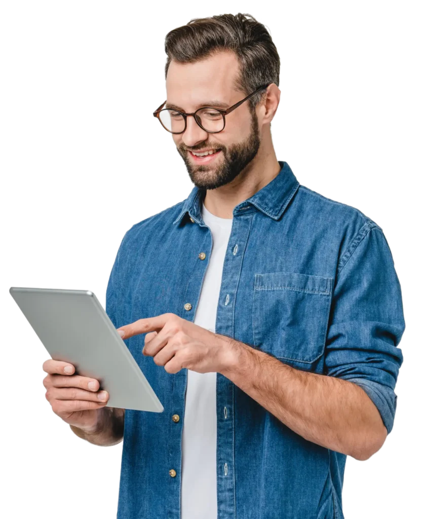 Person smilling and looking at a laptop